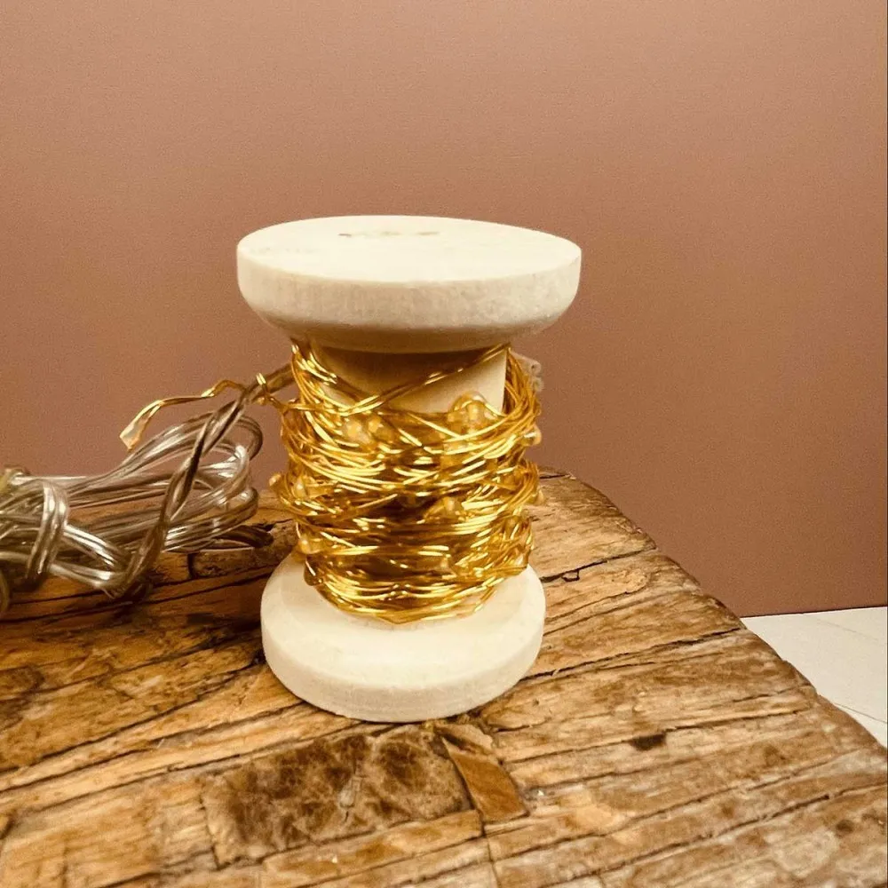 Bobine guirlande dorée 60 LED blanches 6m - Opjet Paris